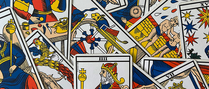 assorted old tarot cards mixed up