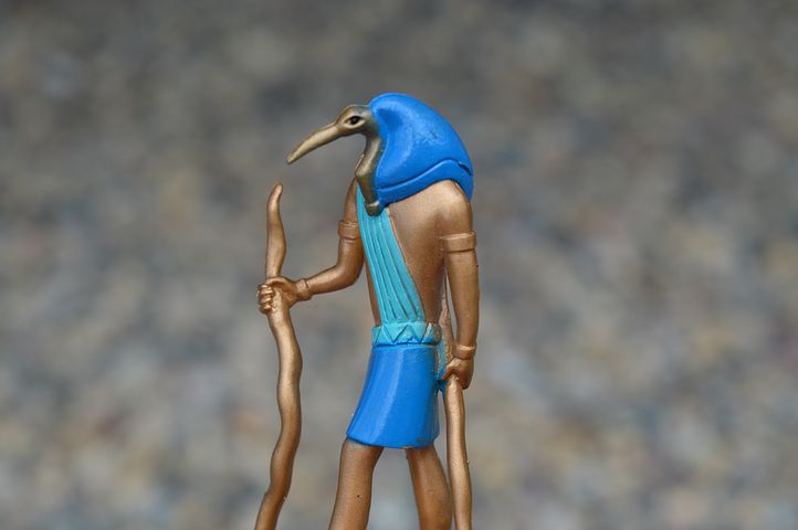 image of the falcon headed Egyptian god Thoth in bronze and turquoise